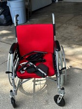 wheelchair practically new Lovely red color, hand controls too  And back break