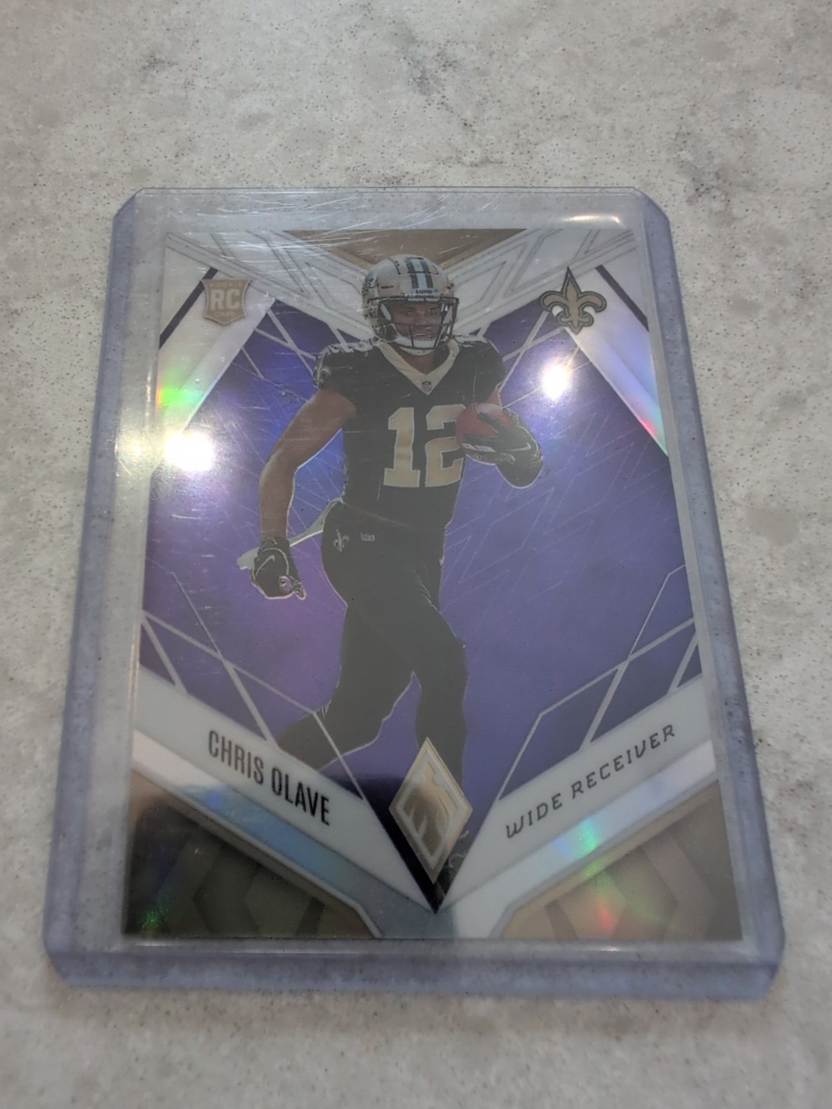 2022 Panini Phoenix - Rookies Chris Olave #109 Purple /125 (RC)