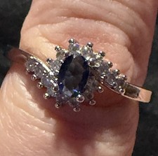 Silver Ring with Oval Blue Sapphire and Clear Accent Stones