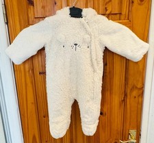 Beautiful spotless baby all in one coat in hand cover mites