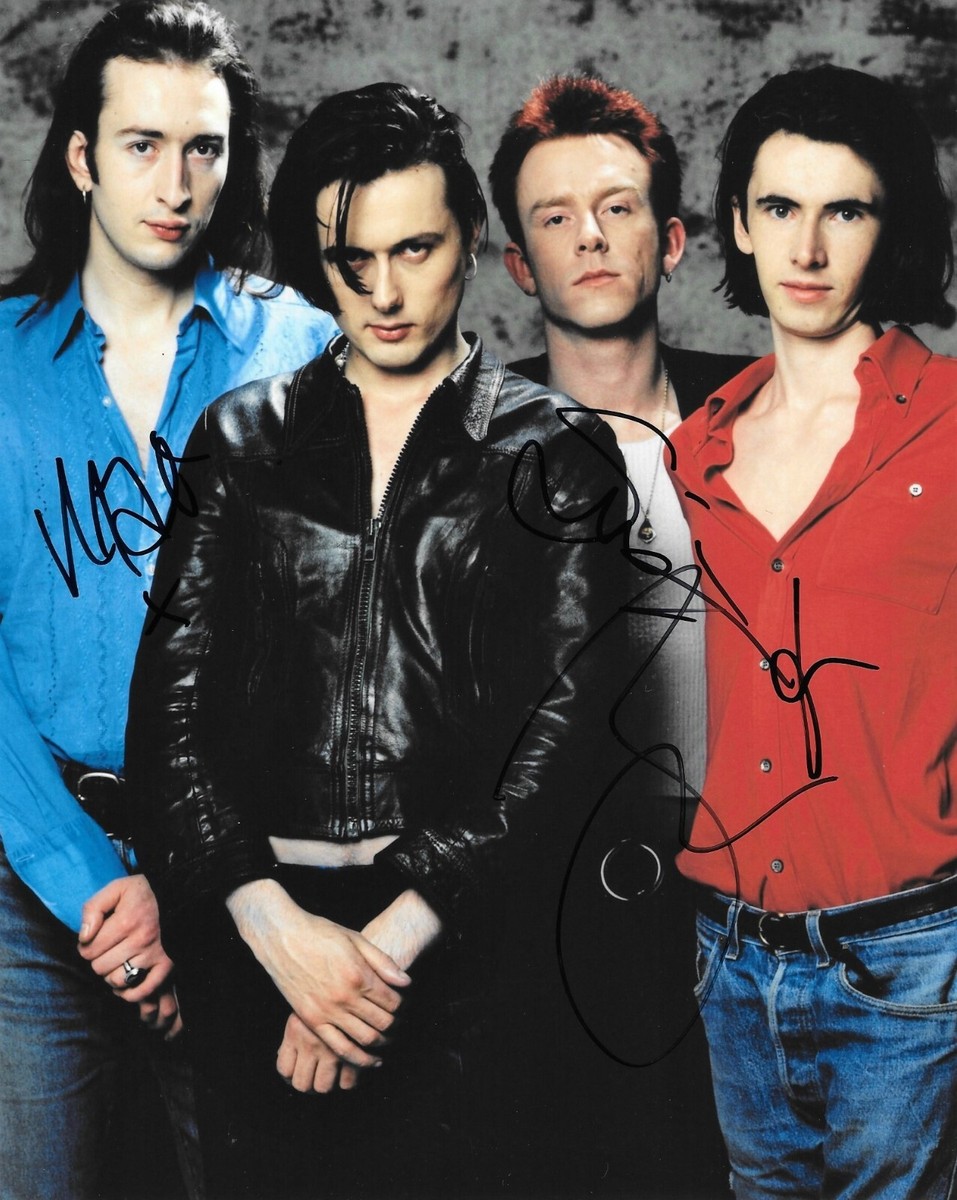 suede rock band altogether before a music gig during the 1990's