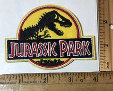Jurassic Park Logo Iron On Patch Dinosaur T-Rex Movie Yellow Background