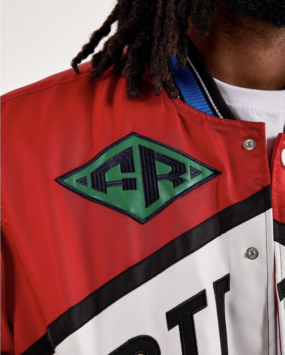 PRIMA FILA (GIACCA UOMO DA CORSA RICAMATA PATCHDVARSITY)