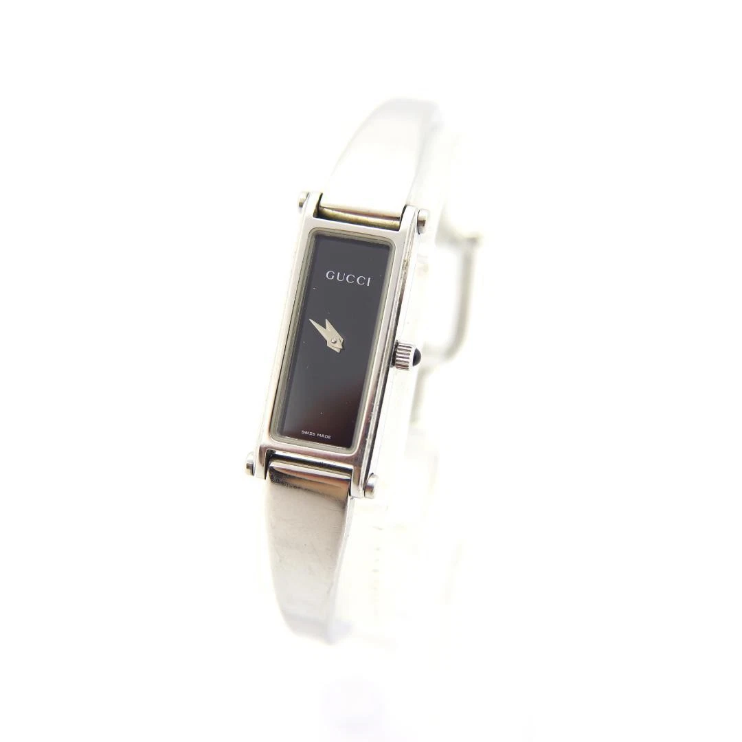 Montre Gucci 1500L rectangle femme fabrication suisse quartz vintage noir argent 12 mm