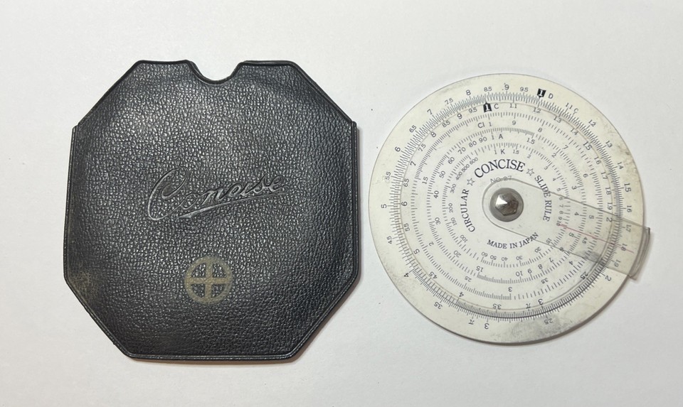 A compact 3.25" Japanese Concise No.27 circular slide rule with original case — a beautifully engineered analog computer that fits in a pocket and still actually works.