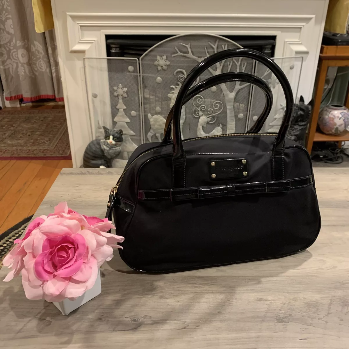Kate spade black purse with white bow sale