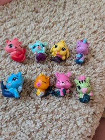 Hatchimals collectibles Pink/Clear Display Case with 8 color changing figures.