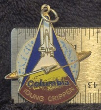 Vintage NASA Space Shuttle Columbia STS-2 mission charm pendant.