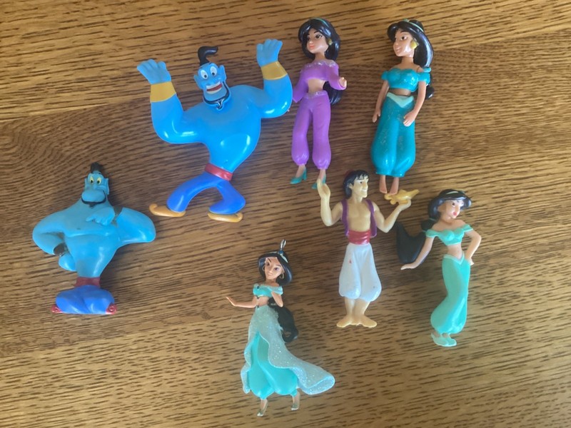 Hallmark Disney Aladdin's Jasmine ornament, along with 6 misc movie figures.