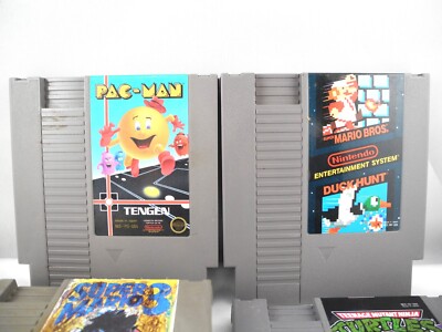 Nintendo NES 4 Game Lot Mario Duck Hunt Ninja Turtles Pac-Man