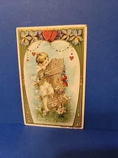 Antique 1910 VALENTINE Postcard LOVE'S TOKEN Cupid Breaks Through DeFENCE Hearts
