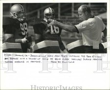 1987 Press Photo Coach Talks to Tony Elliott and DeBruce Clark, Saints Football