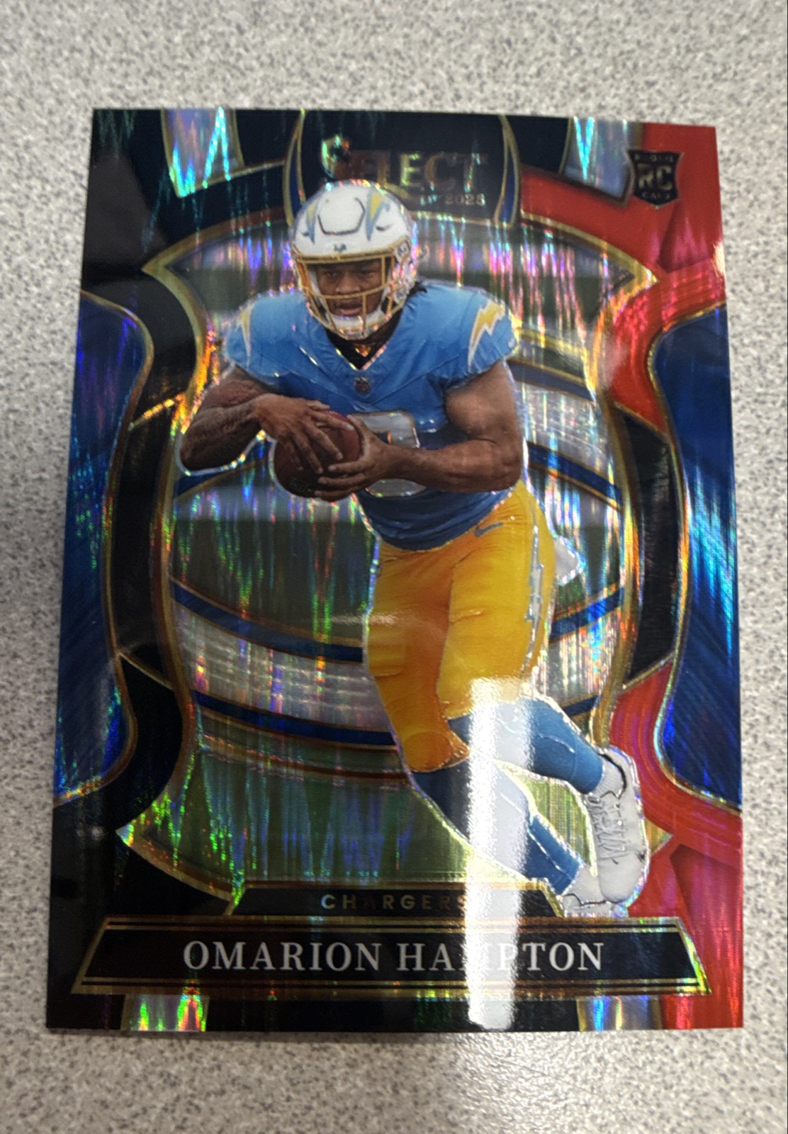 2025 Panini Select - Concourse Omarion Hampton #2 Red & Blue Shock Prizm (RC)