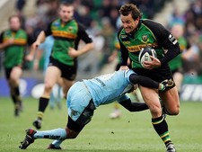 Carlos Spencer of Northampton Saints is tackled by Shane Drahm of - 2005 Photo