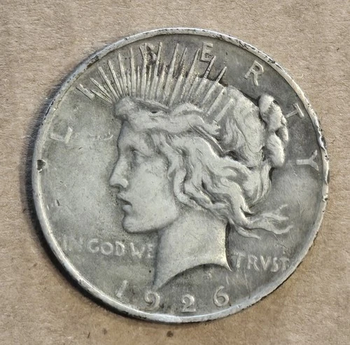 1926 D Peace Dollar. fine with rim damage