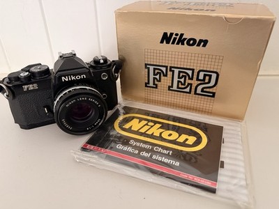 Nikon FE2 Black 35mm SLR Film Camera + Nikon Series E 50mm f/1.8 lens.