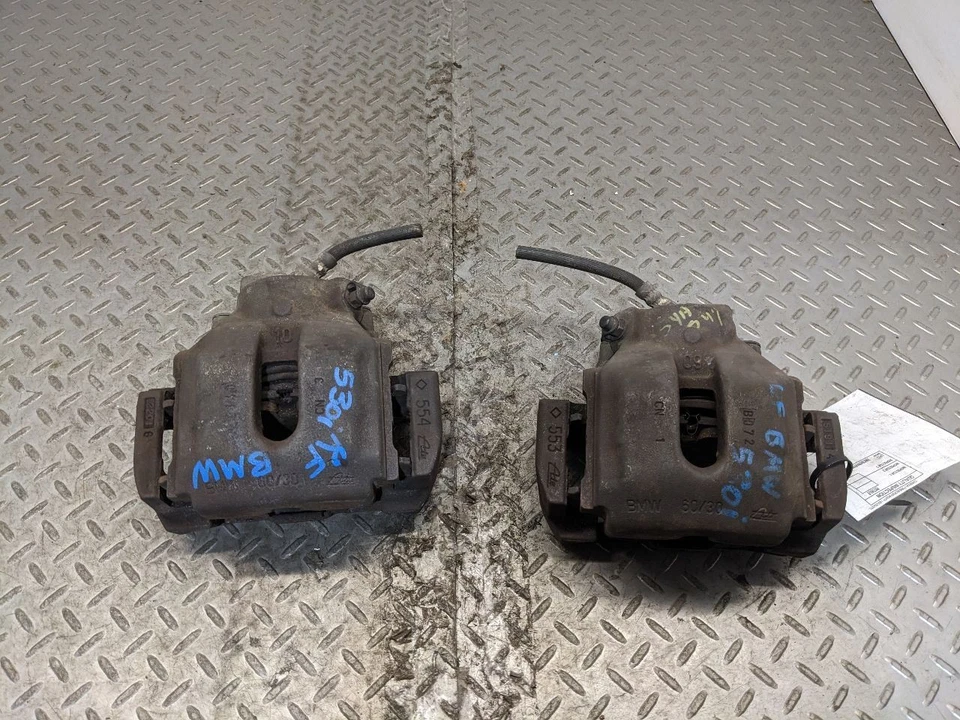 Pinza de freno delantera BMW E38 740IL 740I E39 E83 E53 con par de portadores OEM 1172737 Foto 2 de 4