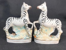 GOOD PAIR OF ANTIQUE STAFFORDSHIRE POTTERY HAND PAINTED ZEBRA FIGURINES