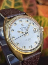 Reloj vintage Croton Nivada Grenchen Orbitron cuerda automática GP venta inmobiliaria funciona