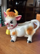 Vintage dairy cow milk jug