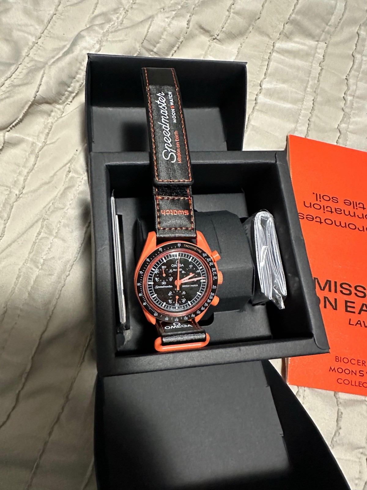 Mission on Orange Lava Swatch x OMEGA Black Speedmaster MoonSwatch Earth Quartz - vintagewatches.pk