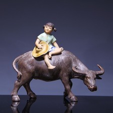 Porcelain Figurine Girl Riding A Water Buffal...