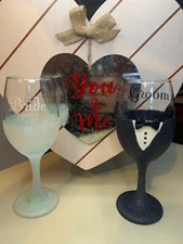 Handmade bride and groom wine glasses.