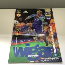 WIGAN ATHLETIC V MANCHESTER UTD THE OFFICIAL OPENING OF JJB STADIUM PROG 1999