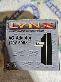 Atari Lynx 1 console working with box and 4 games.