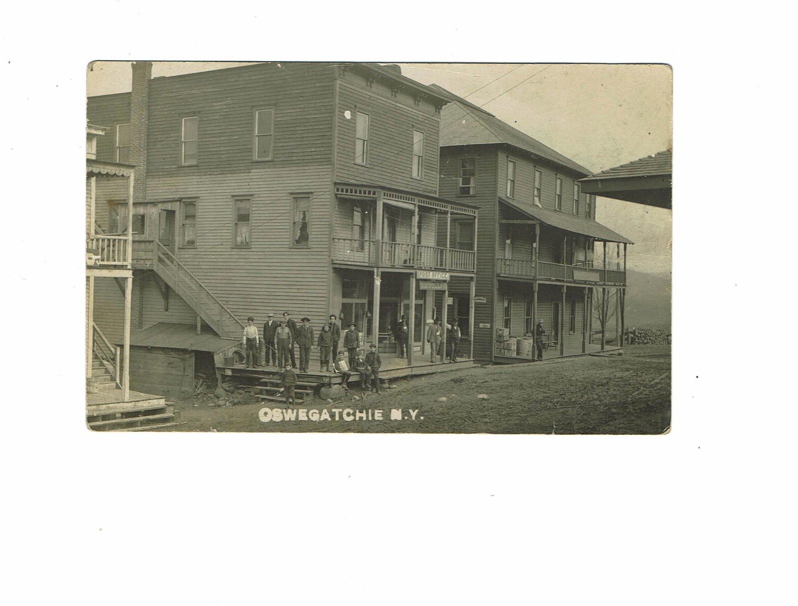 RPPC STOREFRONT AT OSWEGATCHIE, NEW YORK IN THE ADIRONDACK MOUNTAINS