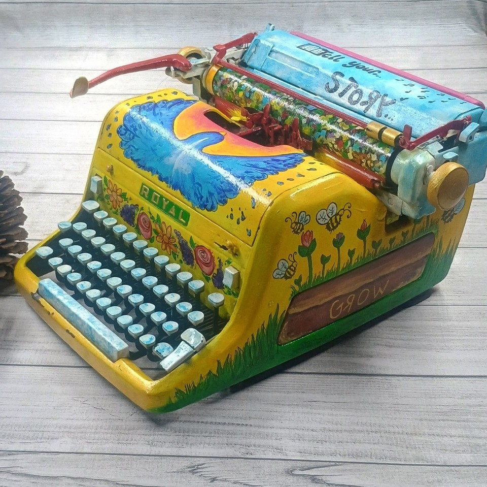 A fully functional Royal typewriter turned into a hand-painted floral-and-bird art object — no two are alike, functional AND wall-worthy.
