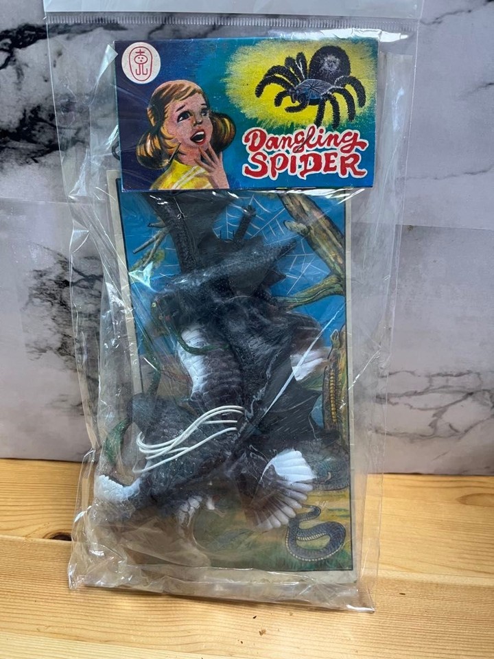 An unopened Showa-era Japanese sofubi (soft vinyl) bat figure from a dagashi candy shop — rare, weird, and delightfully time-capsule in its original packaging.