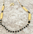 VINTAGE 64" W/ 3" EXTENDER BLACK, IVORY, & GOLD TONE NECKLACE & PIERCED EARRINGS — photo 3