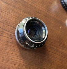 W. Komura 35mm f/3.5 Vintage Manual Focus Lens with Metal Cap Storage Case