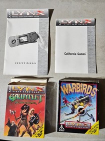 Atari Lynx 1 console working with box and 4 games.