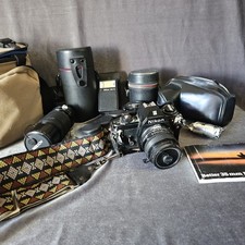 Nikon EM 35mm Film Camera with 3 Lenses, Flash  Cases Not Tested Photo Lot