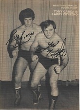 M3714  Tony Garea Larry Zbyszko signed Wrestling Magazine Page w/COA