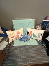 3 Crib Pillows And Dino stuffed toy