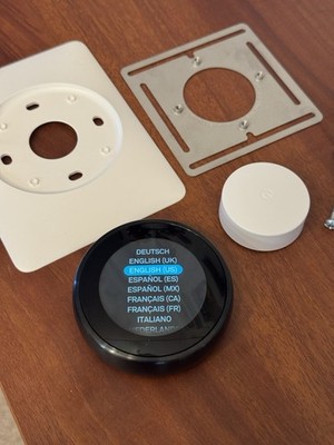 Google Nest Thermostat - 3rd Generation, black bezel.