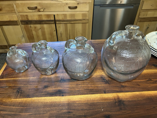 Lot of 4 Clear Glass Embossed Bottles/Decanters w/ Handles & Stoppers