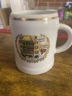 souvenir mug, Goldenes Dachl building and the Tirol coat of arms. — photo 1