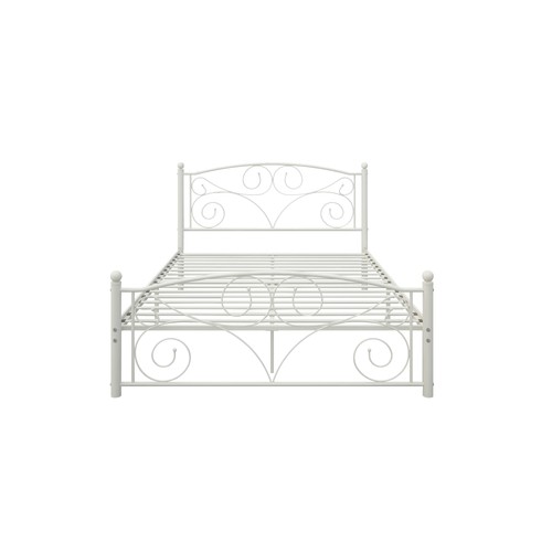 White metal bed frame with unique floral scrollwork headboard and footboard, featuring curved legs and decorative cutout pattern.