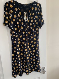 yellow dress with black flowers