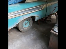 A 1959 Ford Edsel Corsair 2 door Convertible, color, sky blue, interior, B & W. 