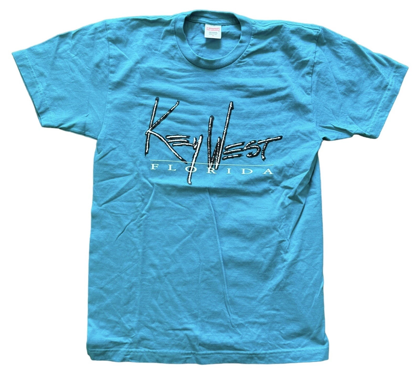 T shirt homme Supreme Key West Floride bleu moyen impeccable 