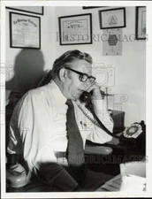 1972 Press Photo Pinellas Chaplain James Riddle talks on the phone in his office