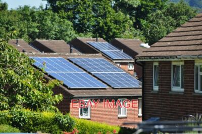 PHOTO  TIVERTON HOUSES & SOLAR PANELS ON A DAY LIKE TODAY I ASSUME IT IS WORTHWH