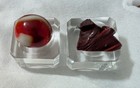 Oxblood Out Of Round Marble & Piece of Akro Agate Manufacturing Cullet & Odditiy — photo 1
