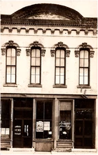 Amboy News Office & Miss Hogan Milliner Shop Illinois 1909 RPPC Postcard Photo