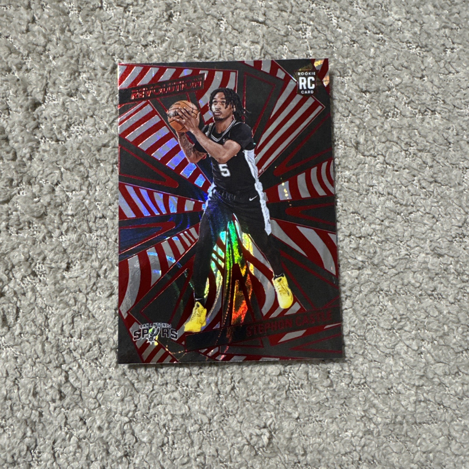 2024-25 Panini Revolution Rookies Stephon Castle #116 Red Swirl (RC) Spurs